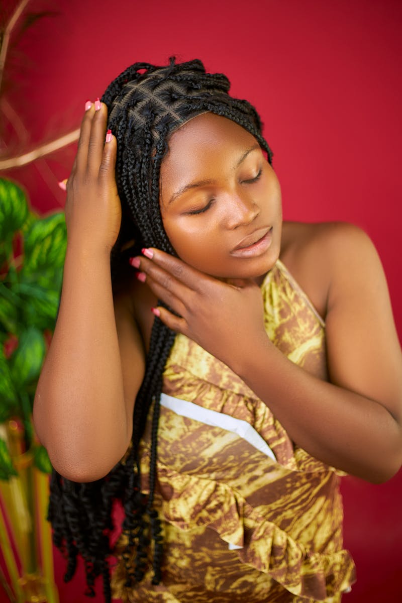 Elegant close-up portrait of woman with braided hairstyle.